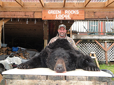 hunter with black bear